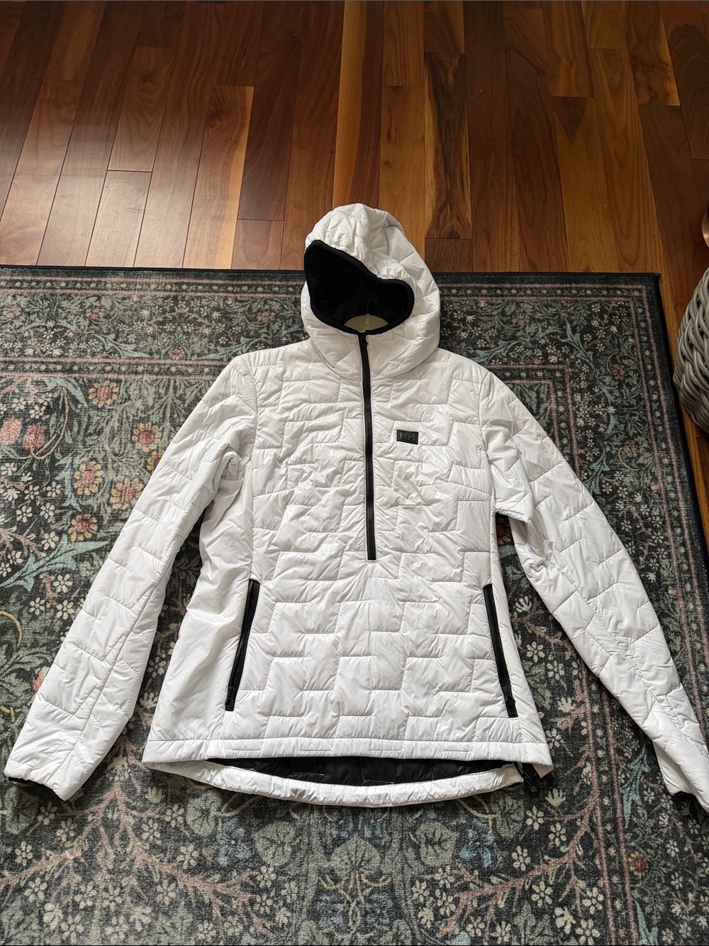 White pullover zip jacket.